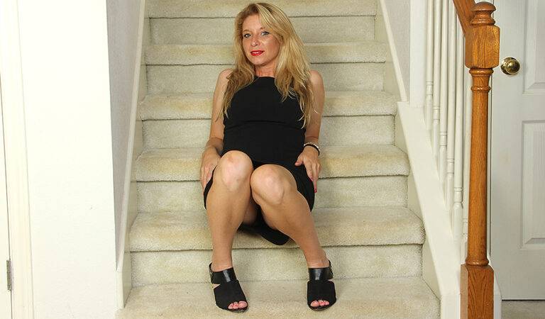 Naughty American MILF playing with her pussy on the stairs